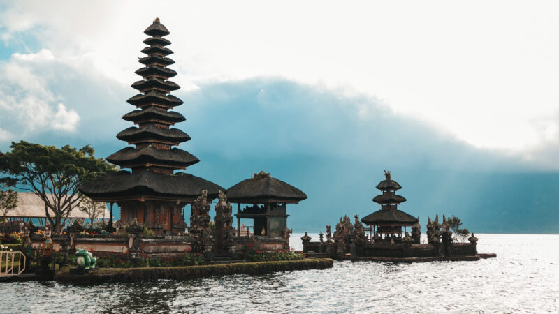 Pura Ulun Danu Bratan, Bali. Hindu temple surrounded by flowers on Bratan lake